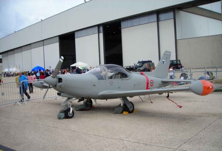 Grey Italian Air Force SF-260EA trainer on the ramp