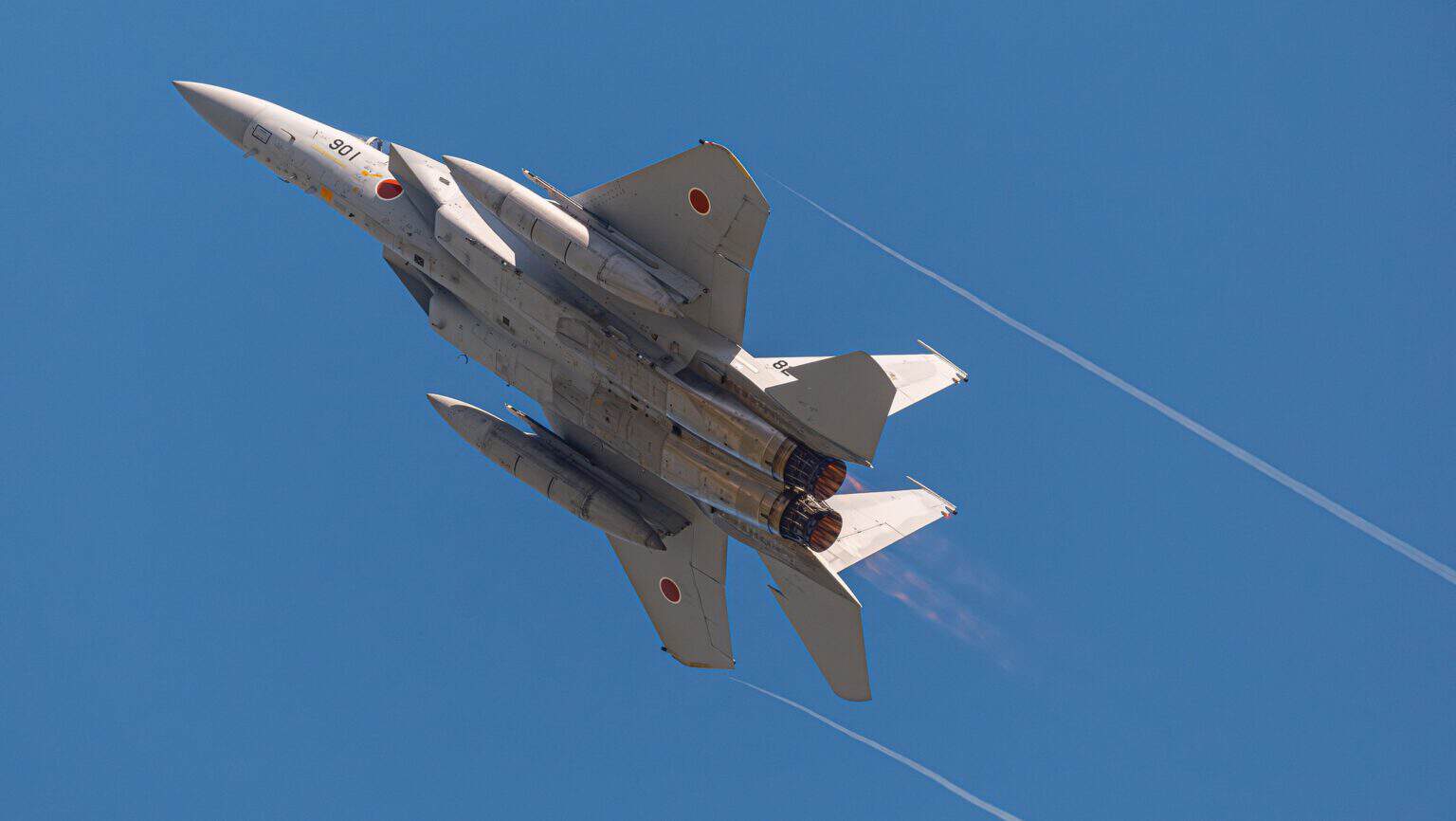JASDF Mitsubishi F-15J Eagle 82-8901 banking in afterburner with vapour trails streaming from its wingtips