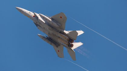 JASDF Mitsubishi F-15J Eagle 82-8901 banking in afterburner with vapour trails streaming from its wingtips