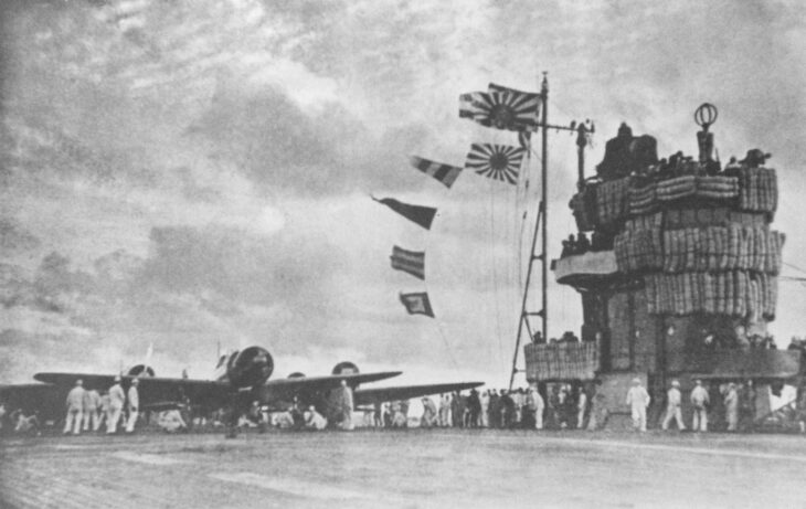Japanese aircraft preparing to launch from Akagi's deck beside the island during the Pearl Harbor second wave