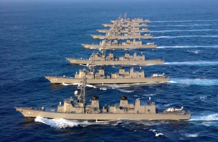 Eight Murasame-type destroyers in line astern at sea