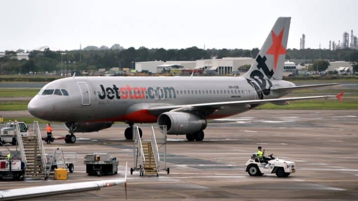 Jetstar Airbus A320 VH-VGR in silver livery with the red star on its tail at Brisbane