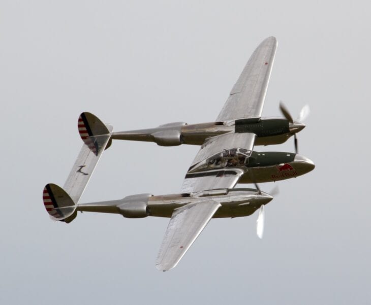 Lockheed P-38 Lightning banking in flight, showing its twin booms