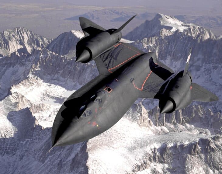 Lockheed SR-71 Blackbird in flight over snow-covered mountains