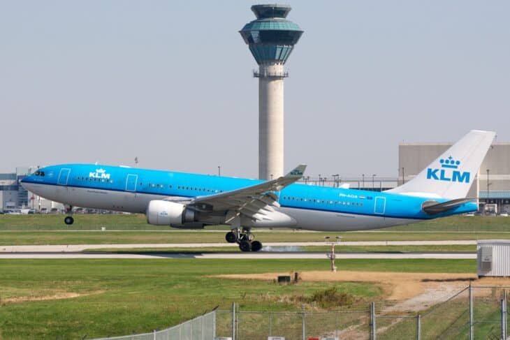 KLM Airbus A330-200 PH-AOA taking off at Toronto Pearson with the control tower behind