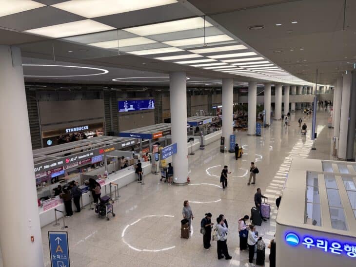 Departures hall of Incheon International Airport Terminal 2 with check-in counters