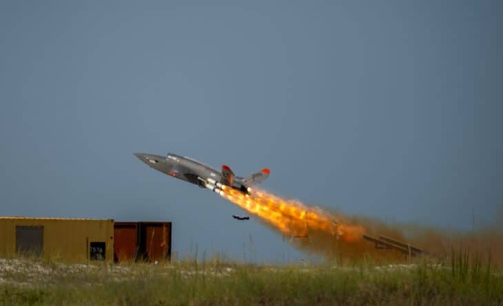 Kratos XQ-58 Valkyrie drone lifting off on a rocket booster at Eglin Air Force Base