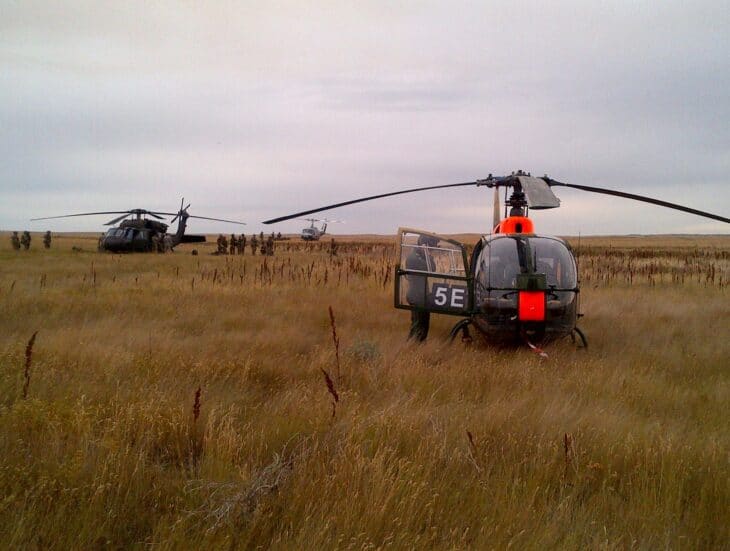 British Army Gazelle helicopter and troops on the prairie at CFB Suffield