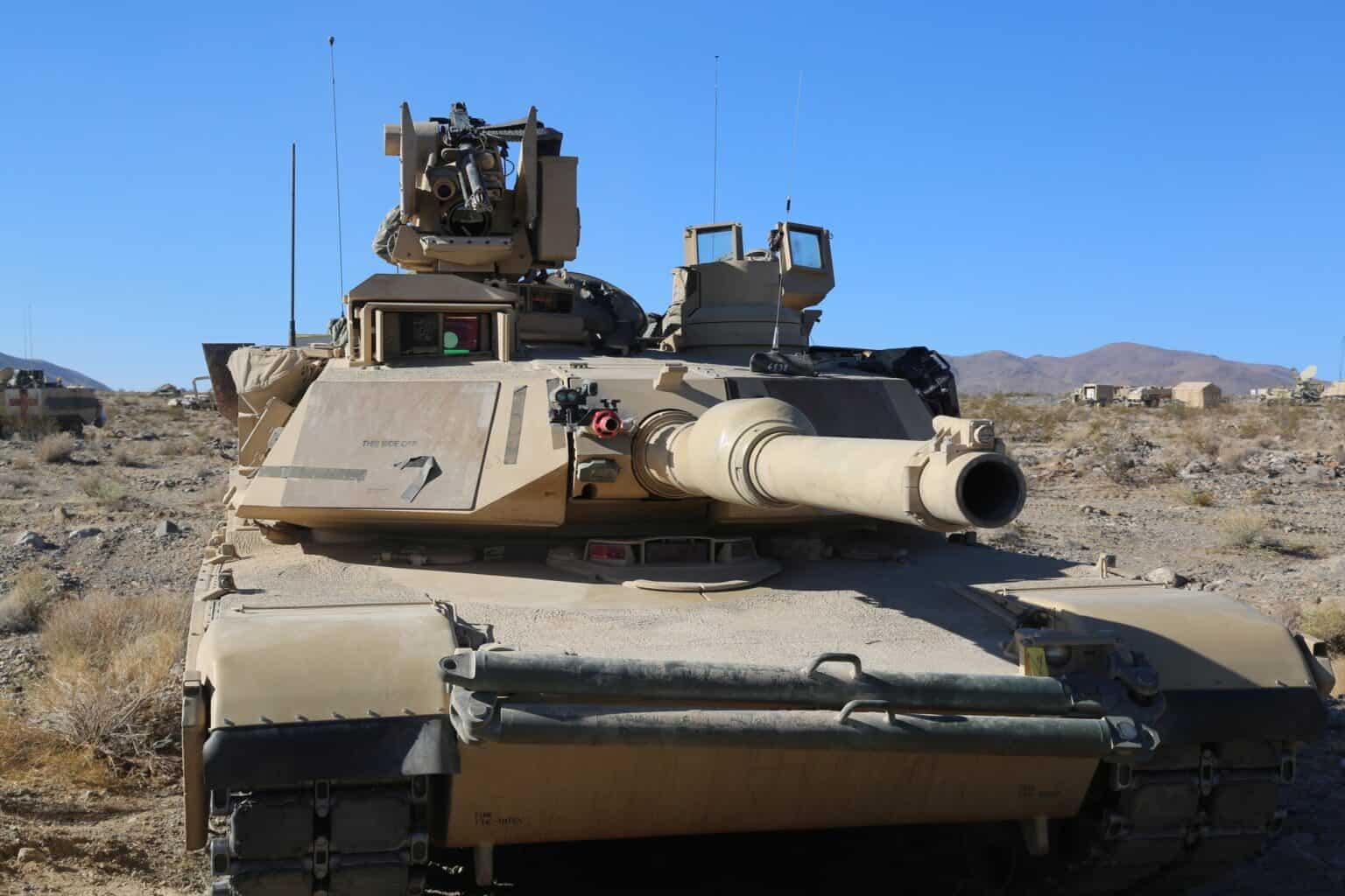 M1 Abrams tank in desert terrain on a training range