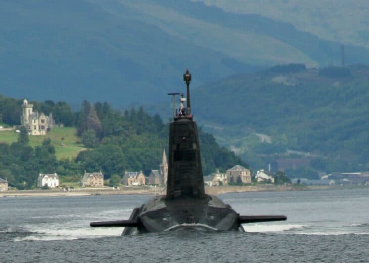 British Vanguard-class submarine head-on on the surface in a Scottish loch