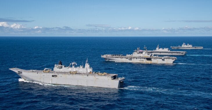 USS America sailing in formation with HMAS Adelaide, JS Izumo and ROKS Marado in the Coral Sea