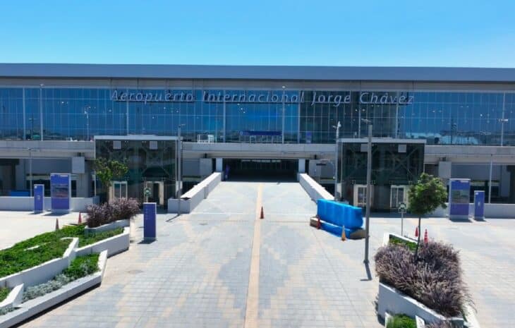 Main terminal facade of Jorge Chávez International Airport in Lima under a clear sky