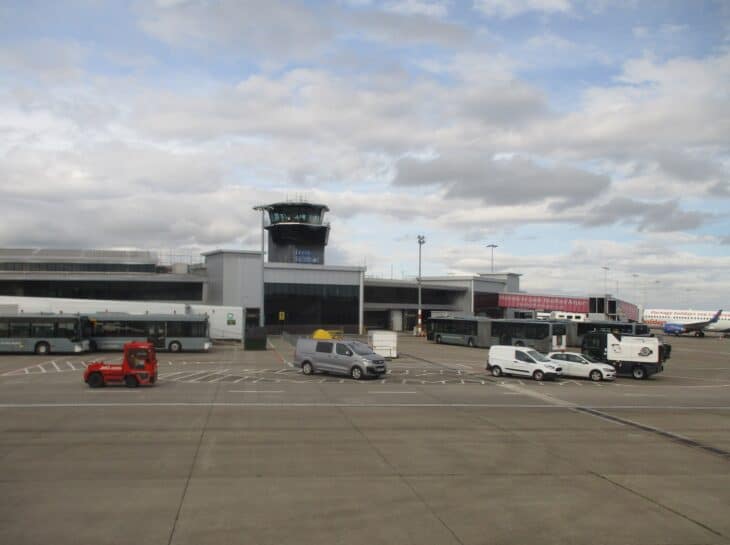 Leeds Bradford Airport control tower beside the terminal, seen from the airfield