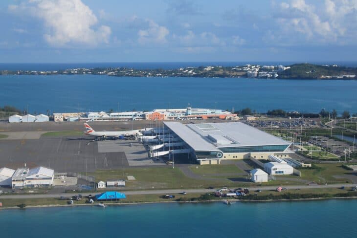 Aerial view of the terminal and apron at L.F. Wade International Airport in Bermuda, with the harbor behind