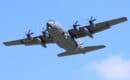 AC-130 gunship banking overhead