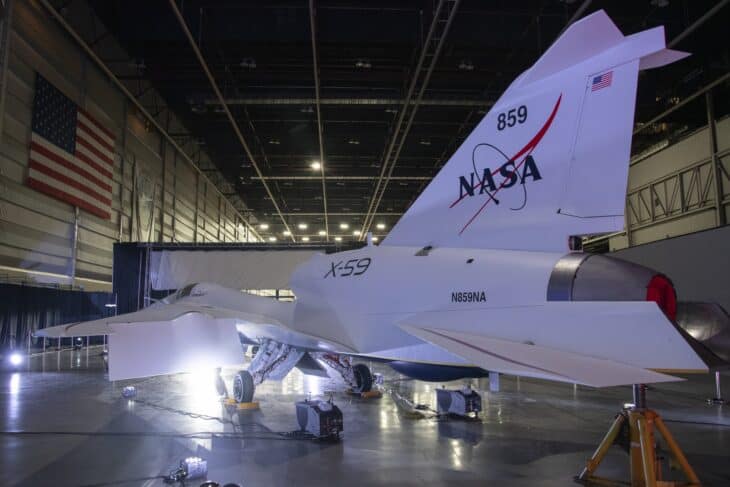 The X-59 tail and NASA livery inside a hangar before its unveiling