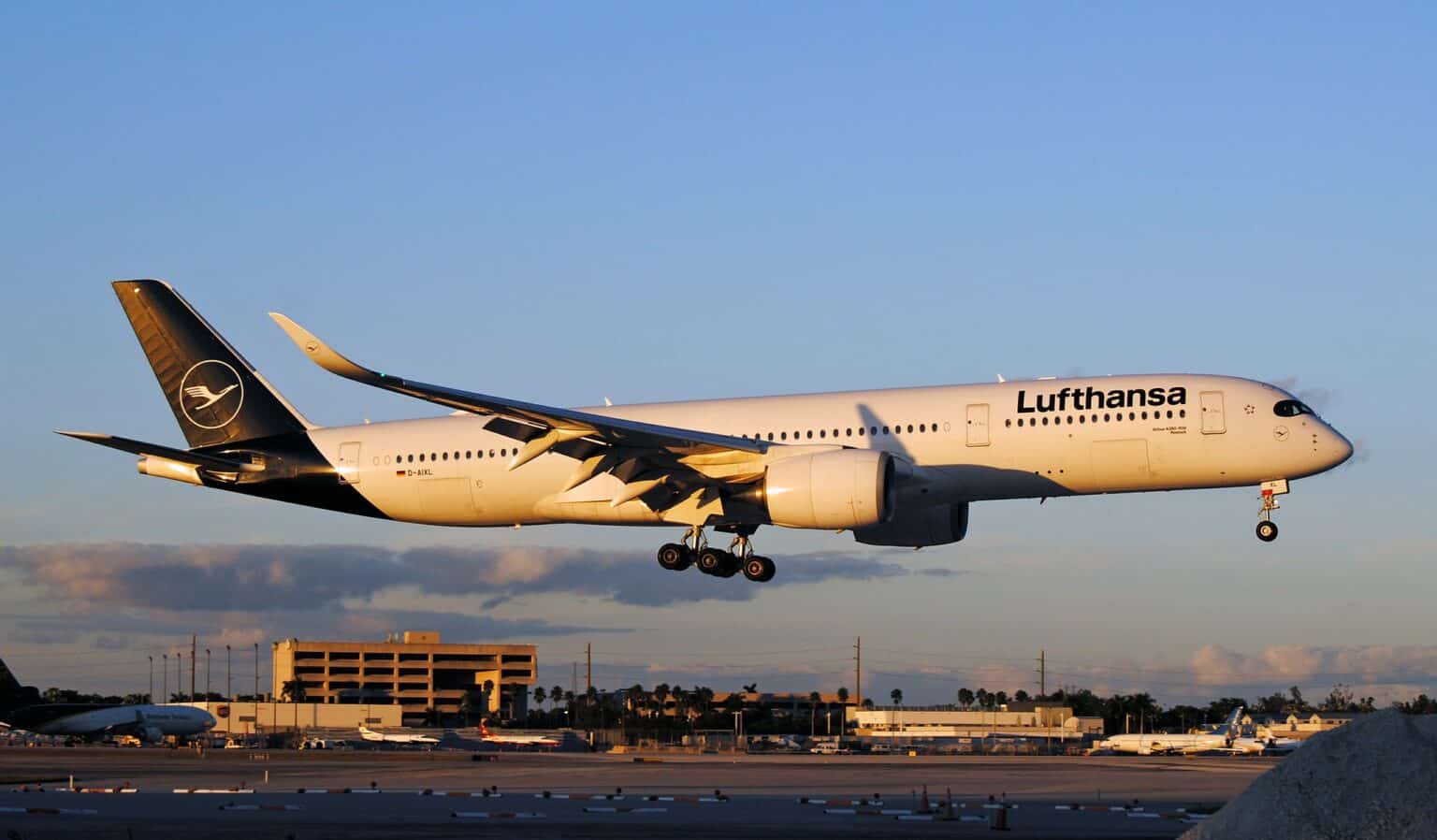 Lufthansa Airbus A350-900 on approach at dusk with landing gear down