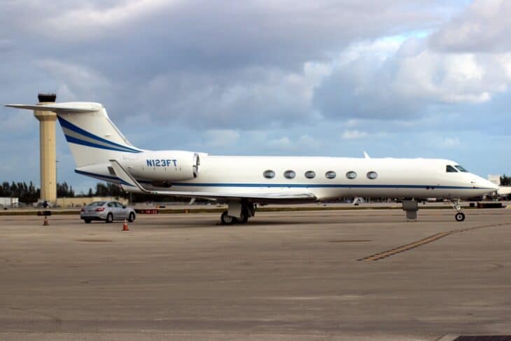 Gulfstream V N123FT, serial 549, parked on the ramp at Palm Beach under a cloudy sky
