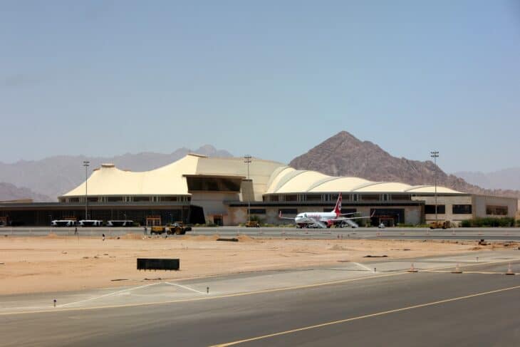 Terminal building at Sharm el-Sheikh International Airport with desert mountains behind