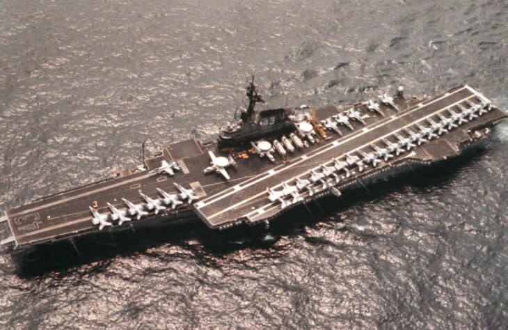 Aerial view of USS Coral Sea with aircraft lined up on the flight deck in 1986