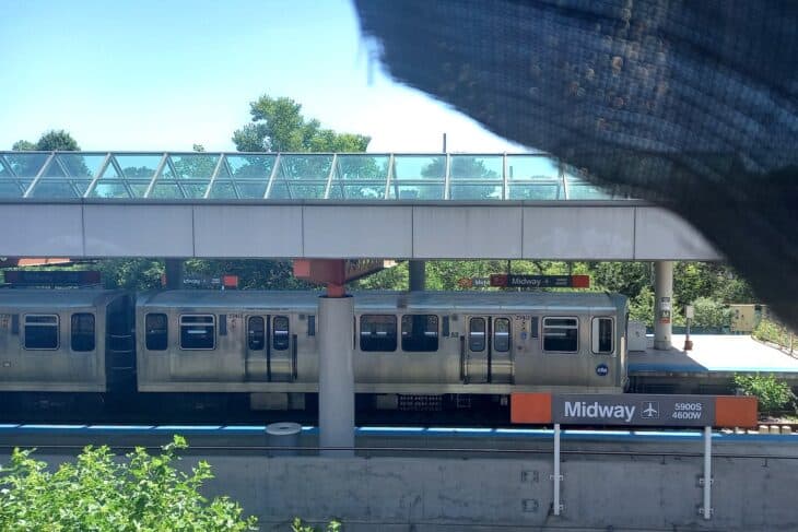 CTA Orange Line train stopped at the Midway station platform