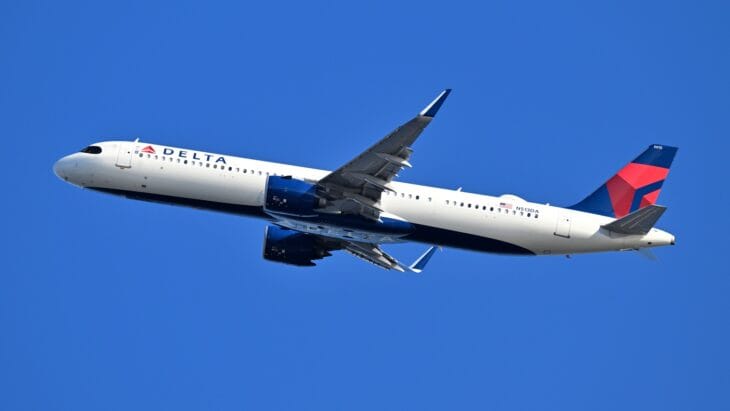 Delta Airbus A321neo N513DA climbing out of Boston against a blue sky