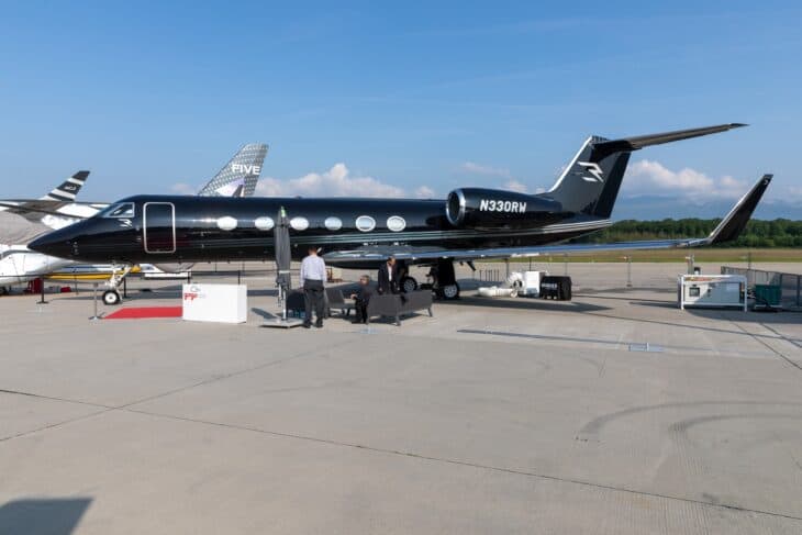 Black Gulfstream IV-SP N330RW parked on the ramp at EBACE 2023 in Geneva