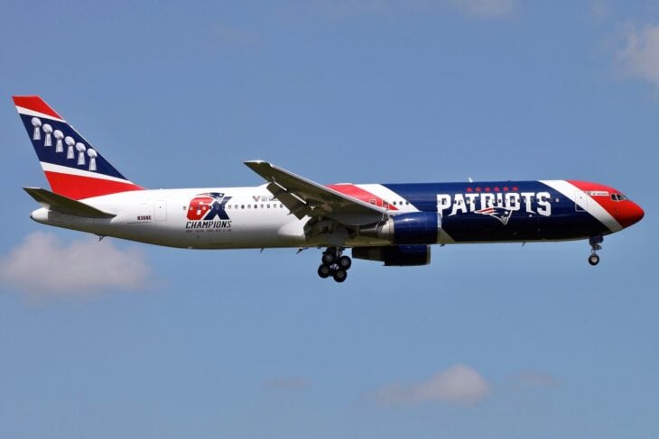 Patriots-liveried Boeing 767 N36NE climbing out with gear retracting