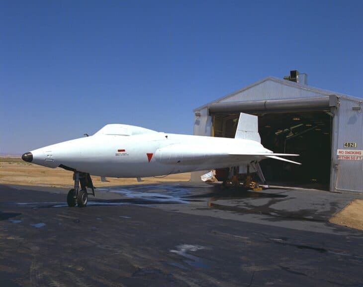 White North American X-15A-2 with ablative coating parked in front of a hangar