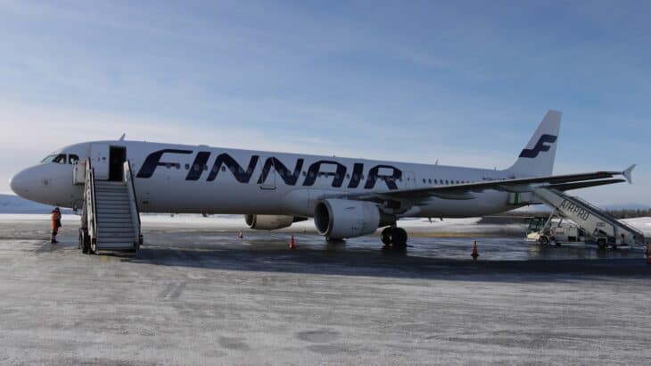 Finnair Airbus A321 OH-LZA parked on the snowy apron at Kittilä airport