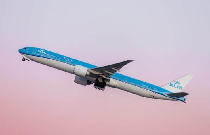 KLM Boeing 777-300ER climbing out of New York JFK in the airline's 100th-anniversary livery