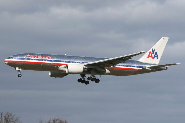 American Airlines Boeing 777-200ER N784AN in the polished-metal livery on approach to Heathrow