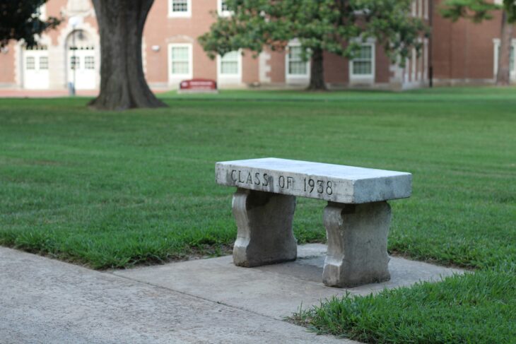 Stone bench inscribed Class of 1938 on a lawn at Southern Illinois University Carbondale