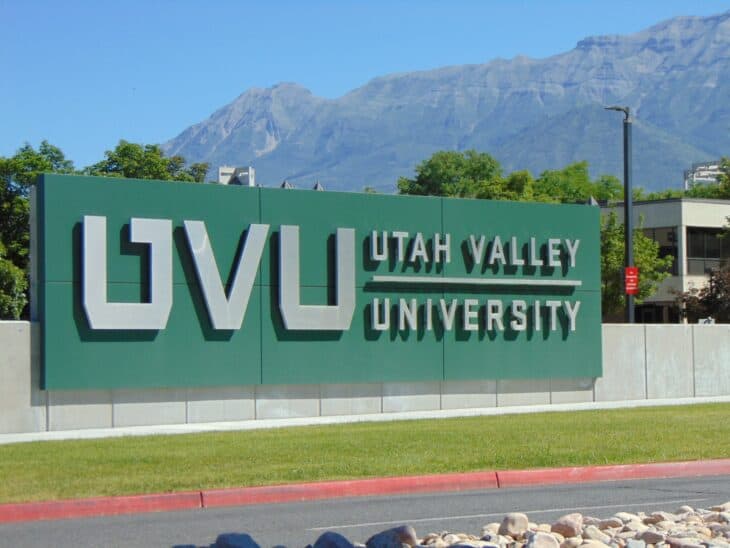 Utah Valley University sign in green lettering in front of the campus