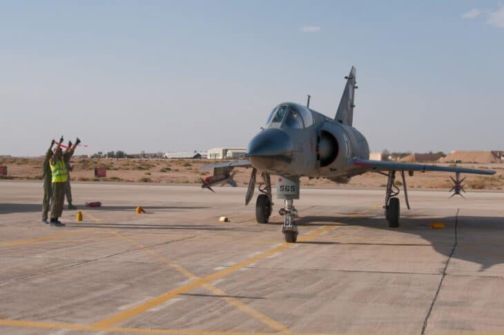 Pakistan Air Force Mirage III ROSE on the ramp with ground crew guiding it
