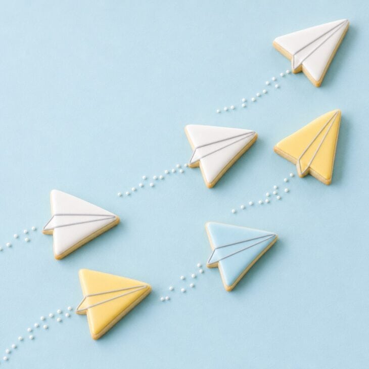 A triangle cutter and two gray lines are all a paper plane needs.