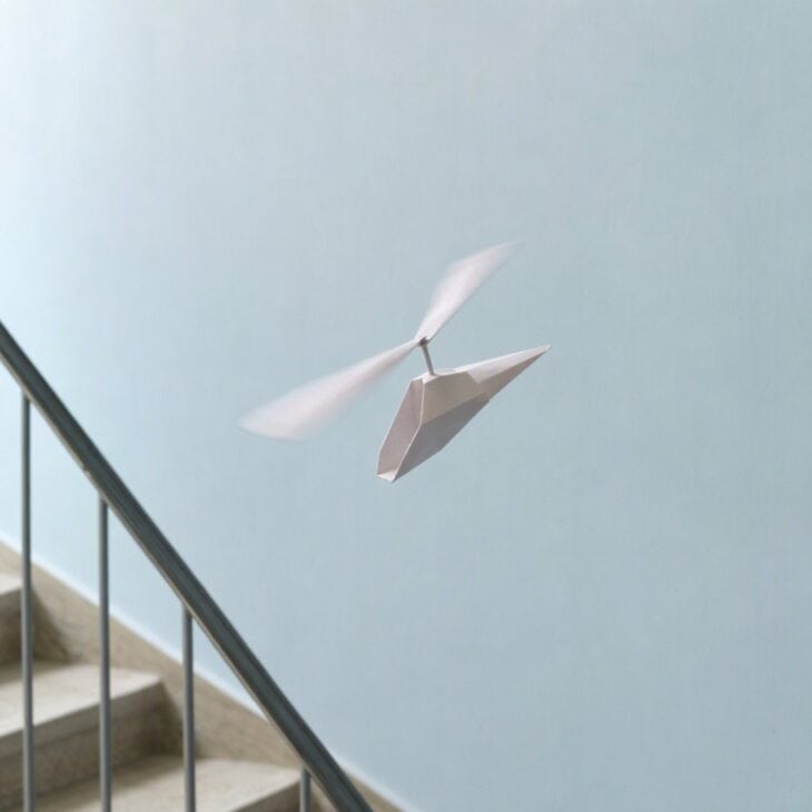 The blades spin as air rushes up through them, slowing the fall.