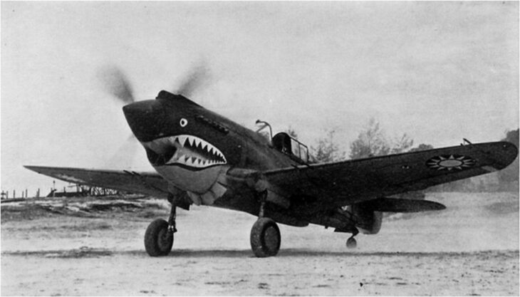 Curtiss P-40C Tomahawk of the American Volunteer Group with its shark-mouth nose, parked on an airfield in China