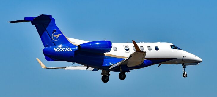 Airshare Embraer Phenom 300 N331AS landing in blue and white livery