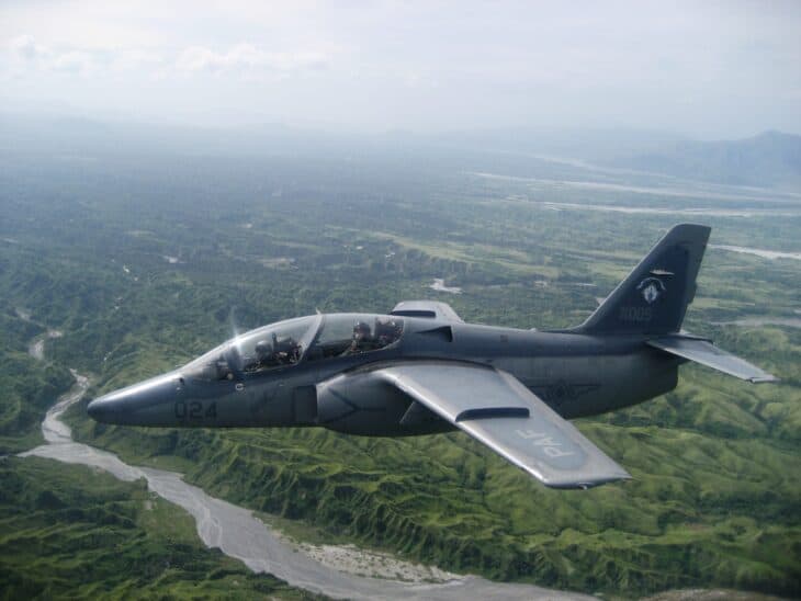 Philippine Air Force SIAI-Marchetti S-211 number 024 flying over a river valley