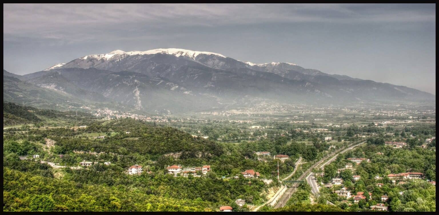 Mount Olympus rising above villages and farmland on the plain of Pieria, northern Greece