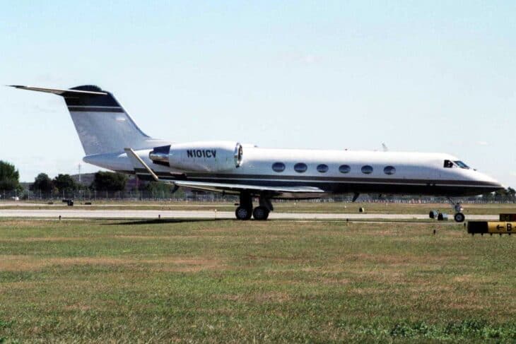Gulfstream IV N101CV taxiing on a grass-edged airport apron in 2005