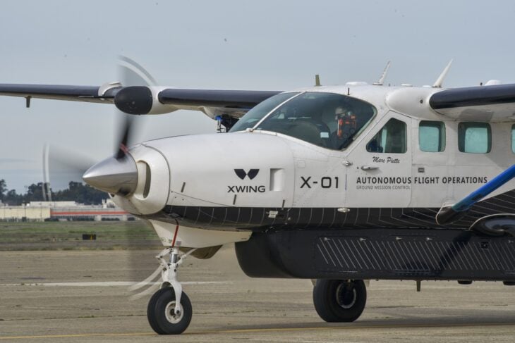 Cessna 208B Grand Caravan with its PT6 turboprop and spinning propeller on the ramp