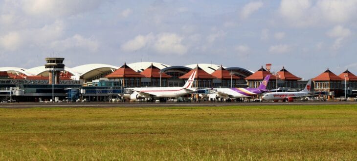 Aircraft parked on the apron in front of the terminal at Bali's Ngurah Rai International Airport