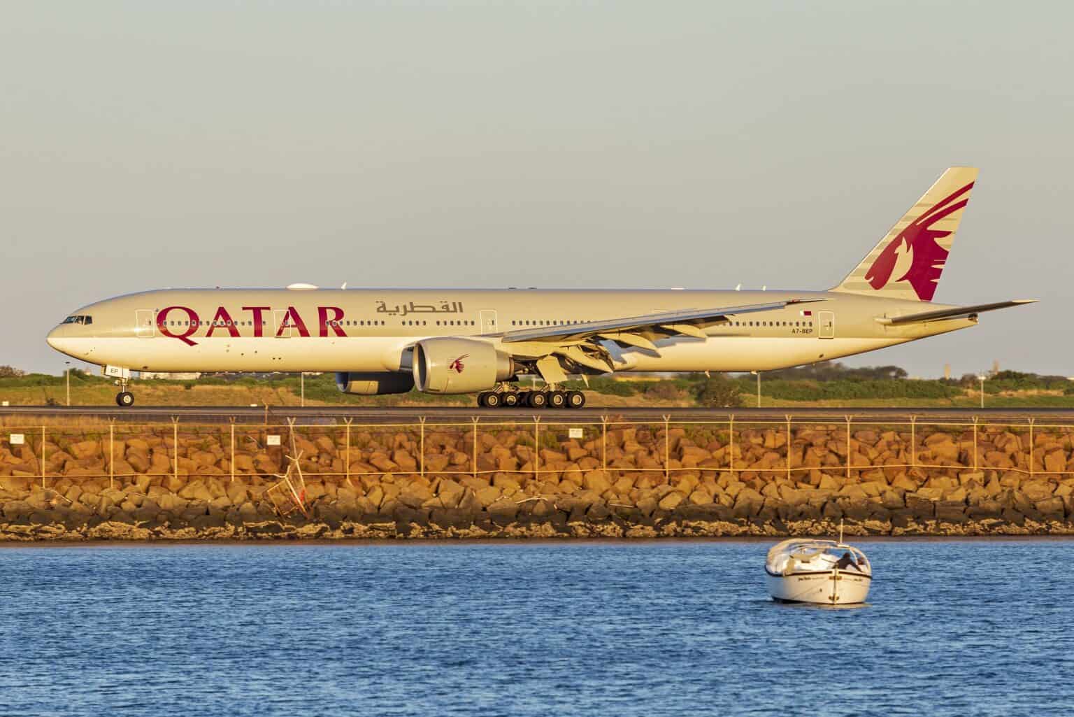 Qatar Airways Boeing 777-300ER A7-BEP taxiing at Sydney Airport in golden evening light