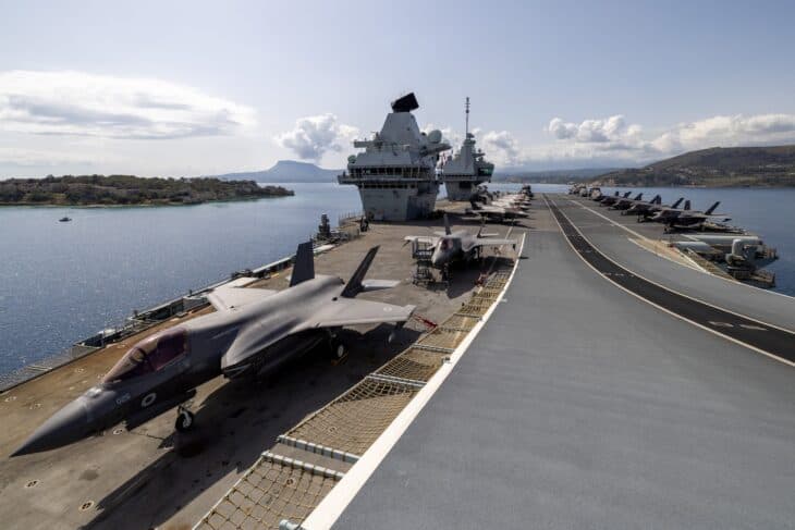 F-35B jets parked on the flight deck of HMS Prince of Wales with the forward island behind
