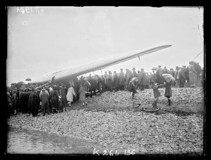 Wing of Byrd's Fokker America on the beach at Ver-sur-Mer, France, 1927