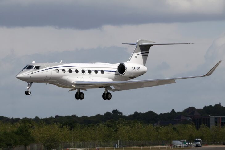 Gulfstream G650ER LX-RAY landing with gear down, registration on the tail
