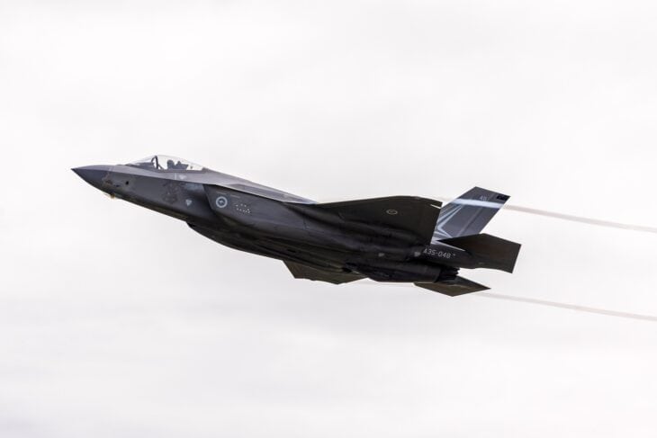 RAAF F-35A A35-048 in a climbing turn with wingtip vortices streaming