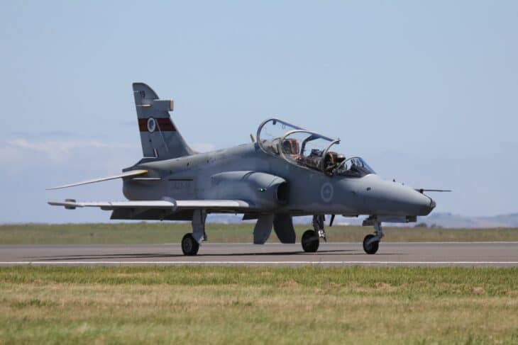 RAAF BAE Hawk 127 A27 taxiing on a runway with canopy open